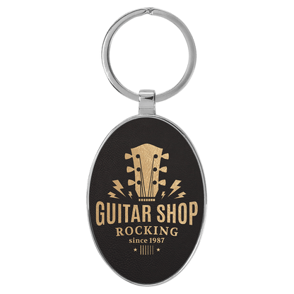 Black/Gold 3" x 1 3/4" Laserable Leatherette/Metal Oval Keychain